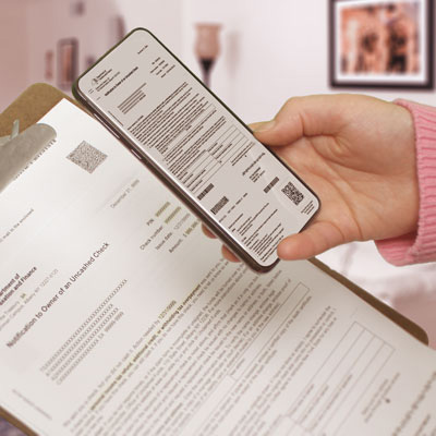 person using phone to scan document