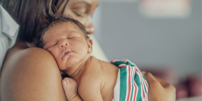 mother holding newborn baby